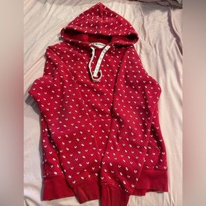 Men’s M True Religion Pullover Hoodie. Small white trademarks over red.